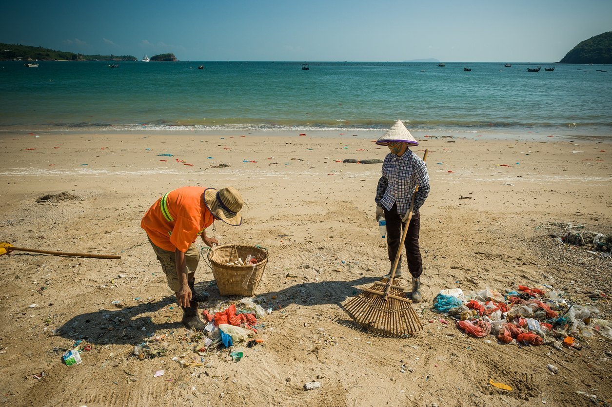 A cleaner clean the rubbish at beach